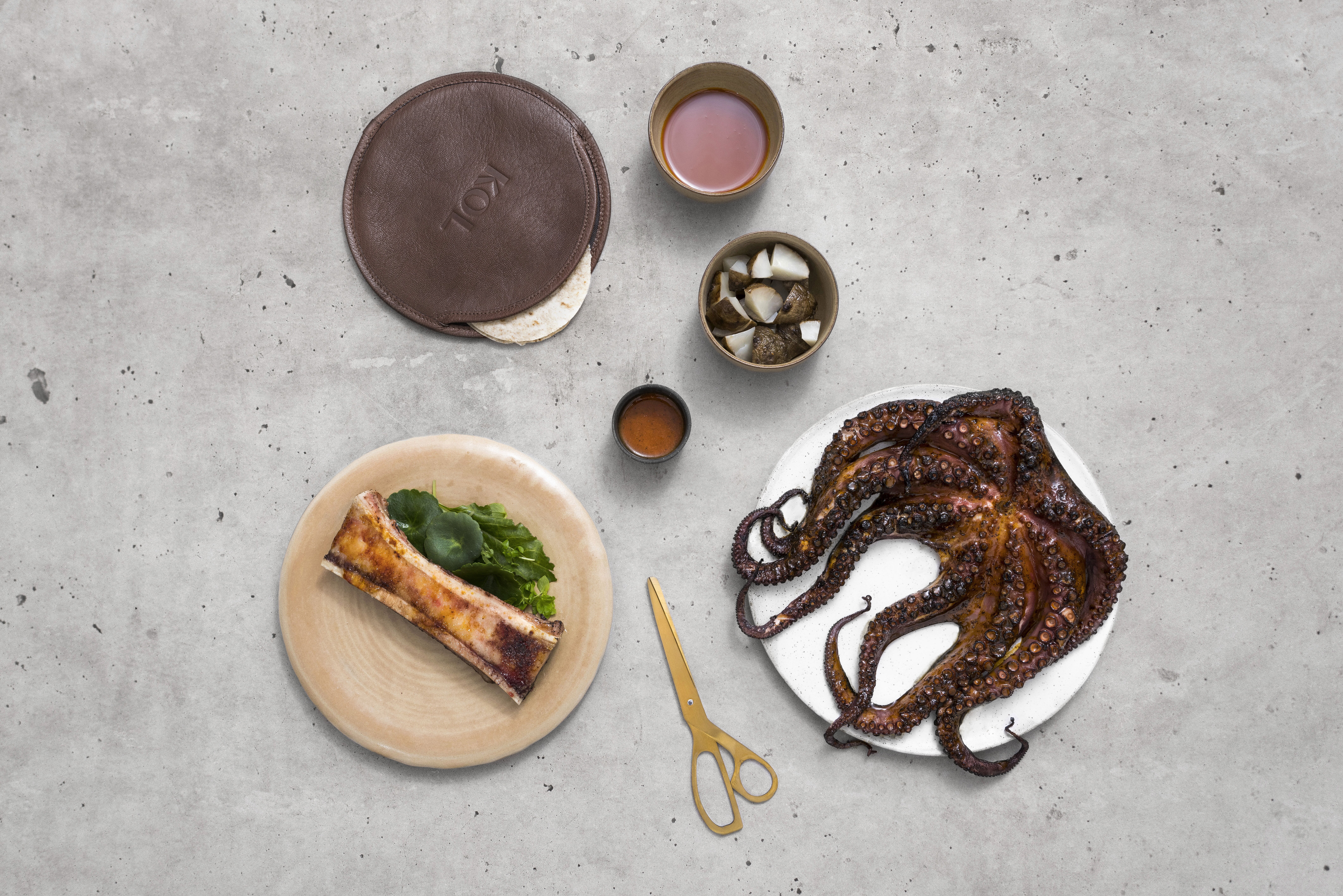 Whole grilled octopus, bone marrow, roots, seaweed macha
